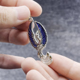 From the ashes rises the rebirth of the  phoenix A fine sterling silver with 14K Gold Accent Pendant TPV2838